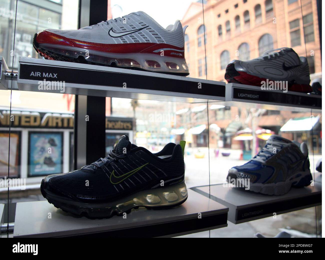 Nike Air Max 360 running shoes share shelf space with other models on a display near a windown in the Niketown in downtown Denver on Tuesday March 21 2006. Nike will post