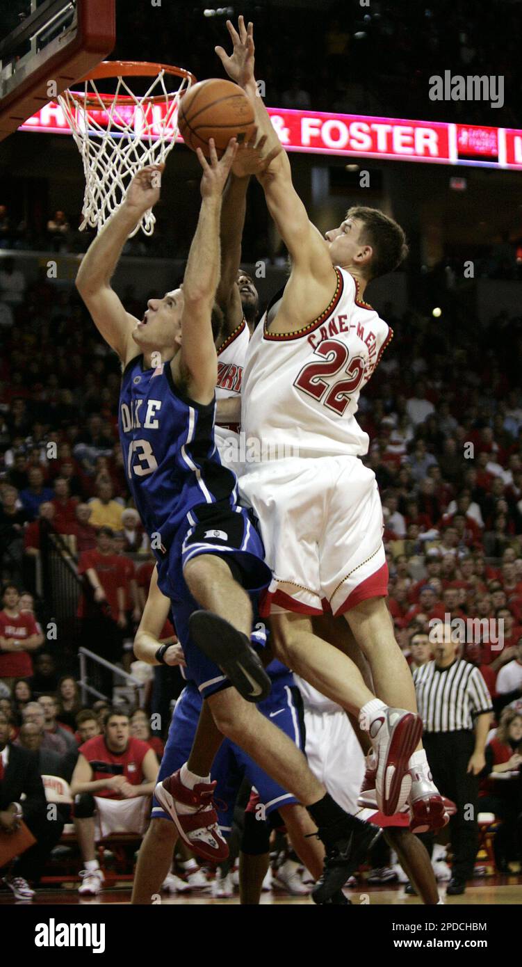 Duke's Lee Melchionni, left, has a layup blocked by Maryland's Nik CanerMedley, right, and