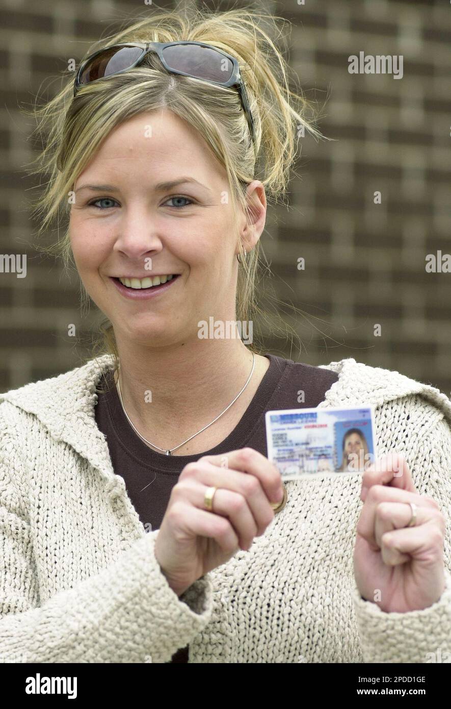 Karri Hoener, 28, of rural Owensville, Mo., poses with her recently