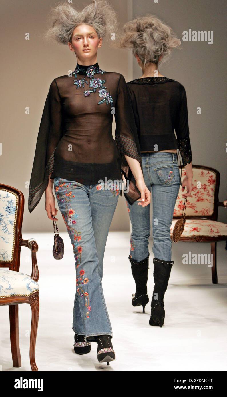 Models display hand embroidered jeans with a beaded black organdy blouse during Chris Celin Paris 2006 Spring and Summer Collection by Japanese director Shinjiro Asatsuki during the Japan Fashion Week in Tokyo Tuesday, Nov. 1, 2005. Chris Celin Paris made a debut in the Tokyo collection. (AP Photo/Katsumi Kasahara) Stockfoto