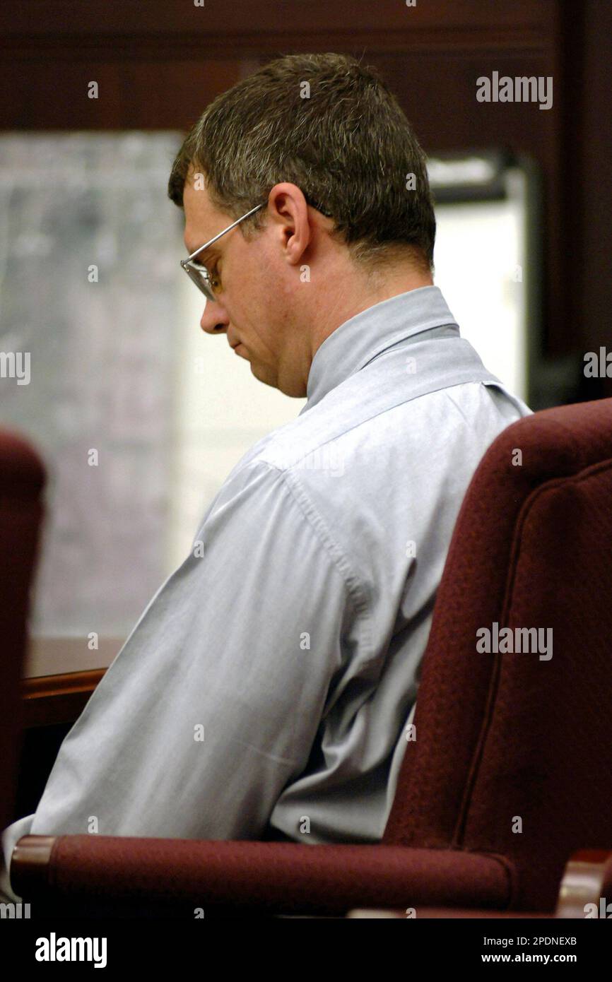 James E. Trimble reacts to crime scene and autopsy photos shown of his