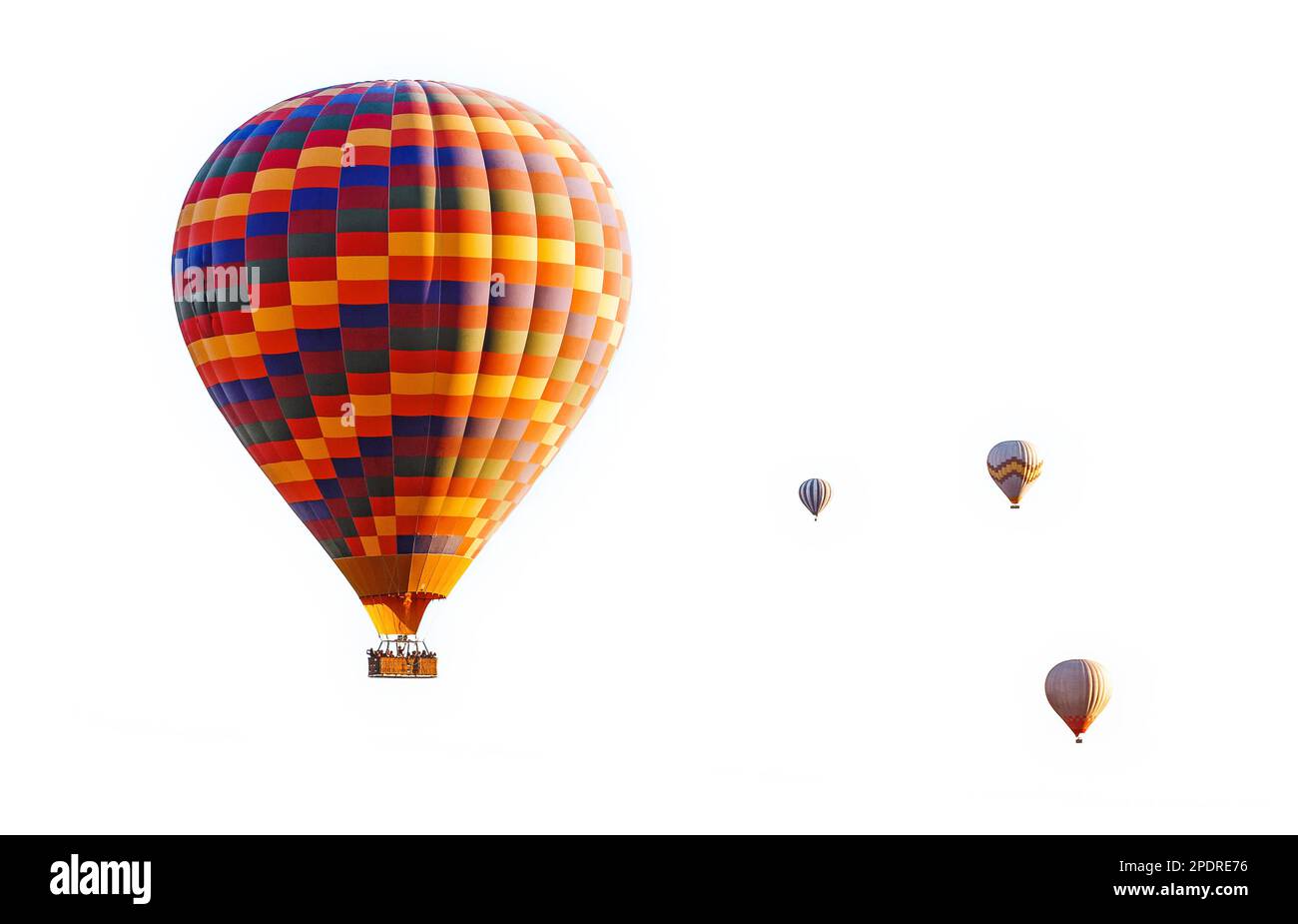 Gruppe von farbenfrohen Heißluftballons, isoliert auf weißem Hintergrund Stockfoto