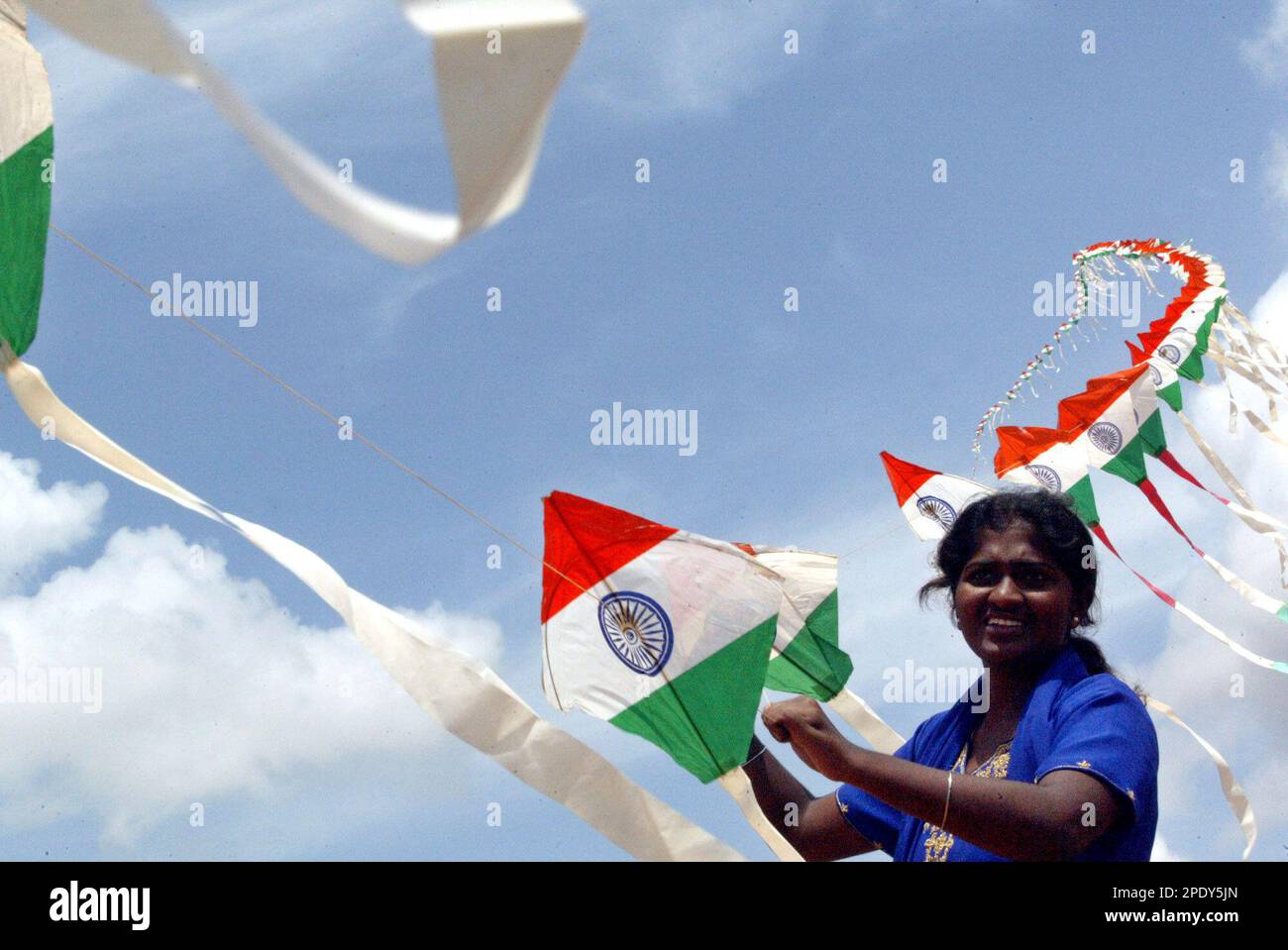 B. Poornima of the Ladies Kite Club of Mysore, holds the line bearing 500 kites printed with the