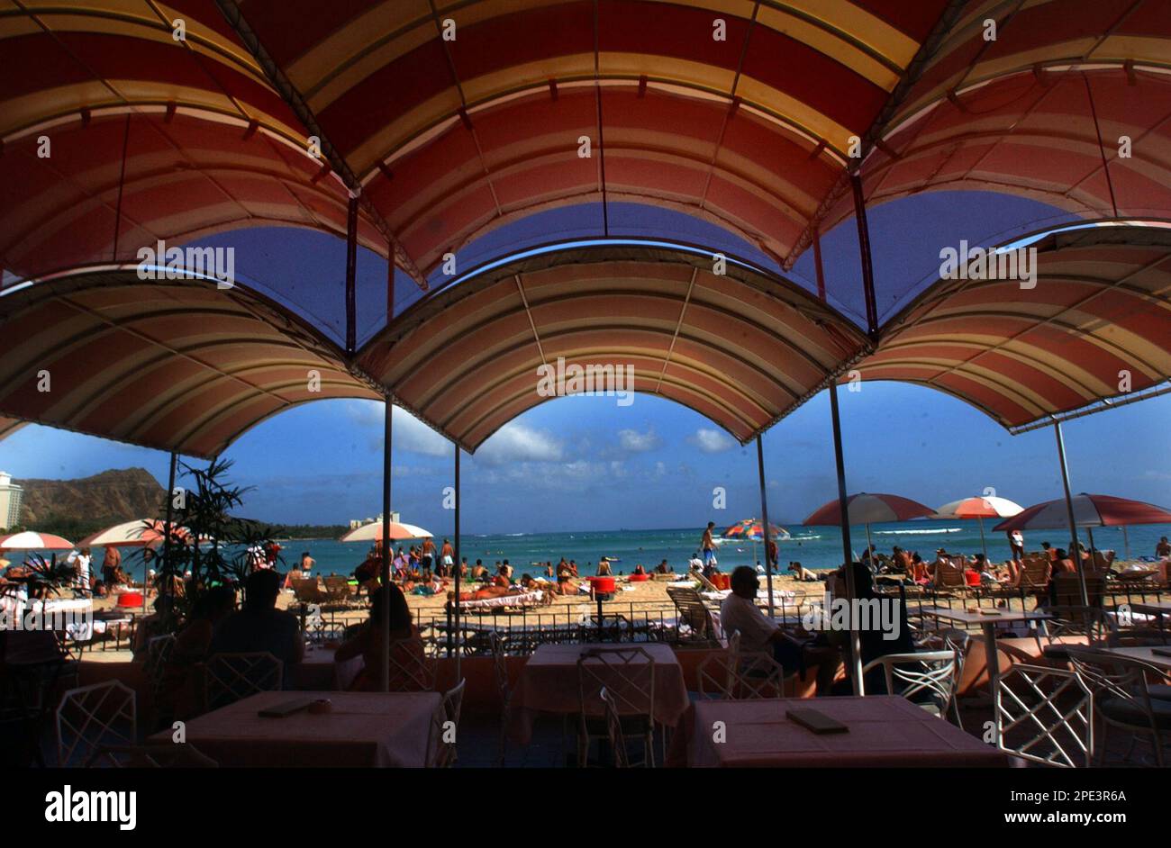 Colorful awnings add shade to the Mai Tai Bar at the Royal Hawaiian