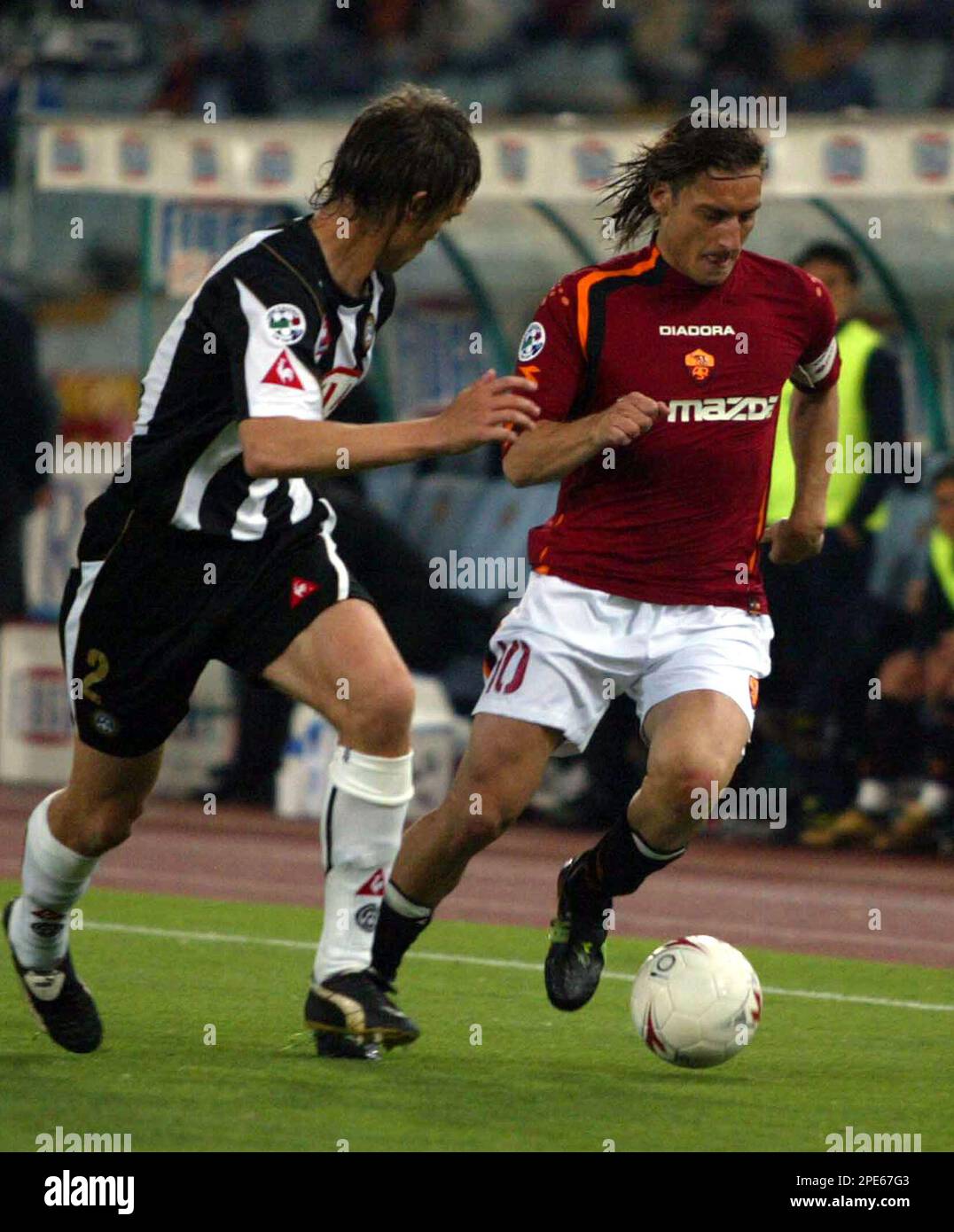 AS Roma's Francesco Totti, Right, Is Chased By An Unidentified Udinese ...