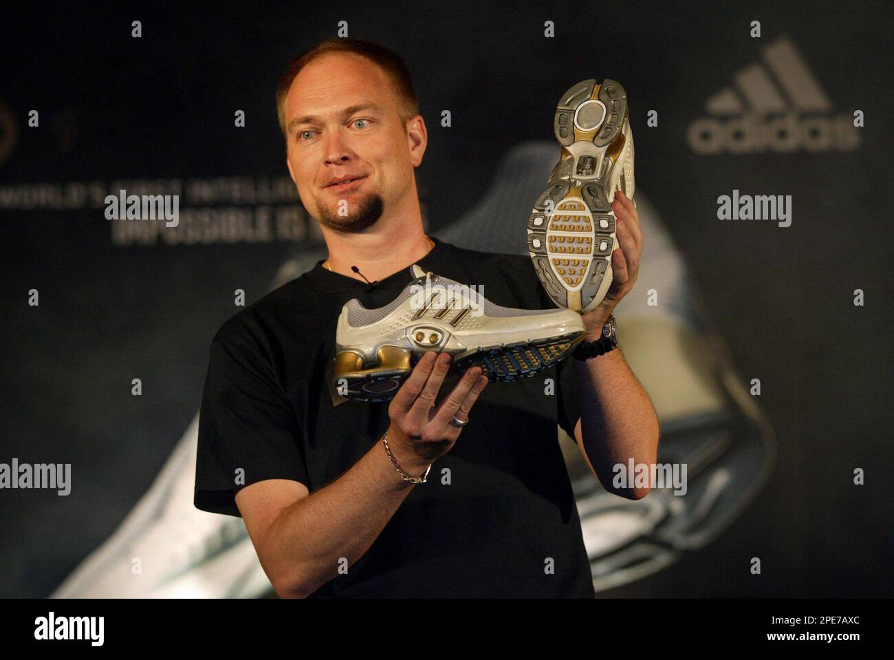 Andreas Gellner Managing Director Adidas India Marketing Pvt. Ltd. poses for the media with the Adidas 1 shoes during the launch in India in New Delhi Wednesday April 27 2005. According to a