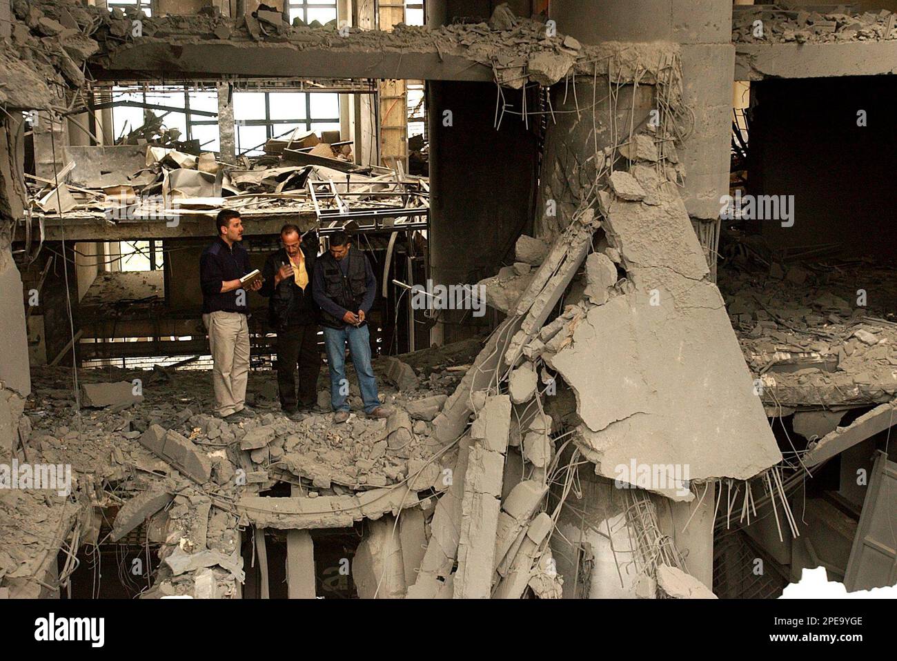 Lebanese investigators, inspect the wrecked Alta Vista Shopping Center
