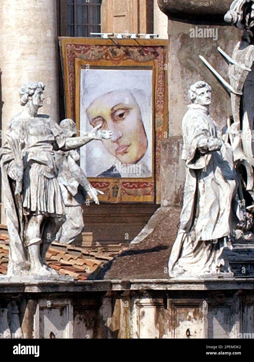 Poper Reign A tapestry hanging outside St. Peter's basilica at the Vatican shows ...