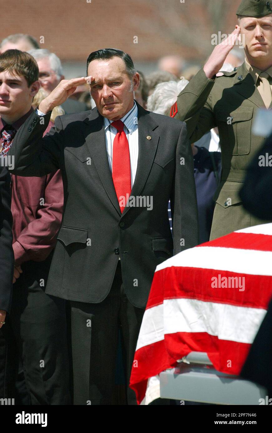 Edward Bohr, left, salutes the casket of his son Marine Gunnery Sgt