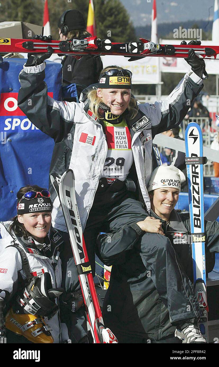 Winner of the women's skiing World Cup super G race Renate Goetschl from Austria, center