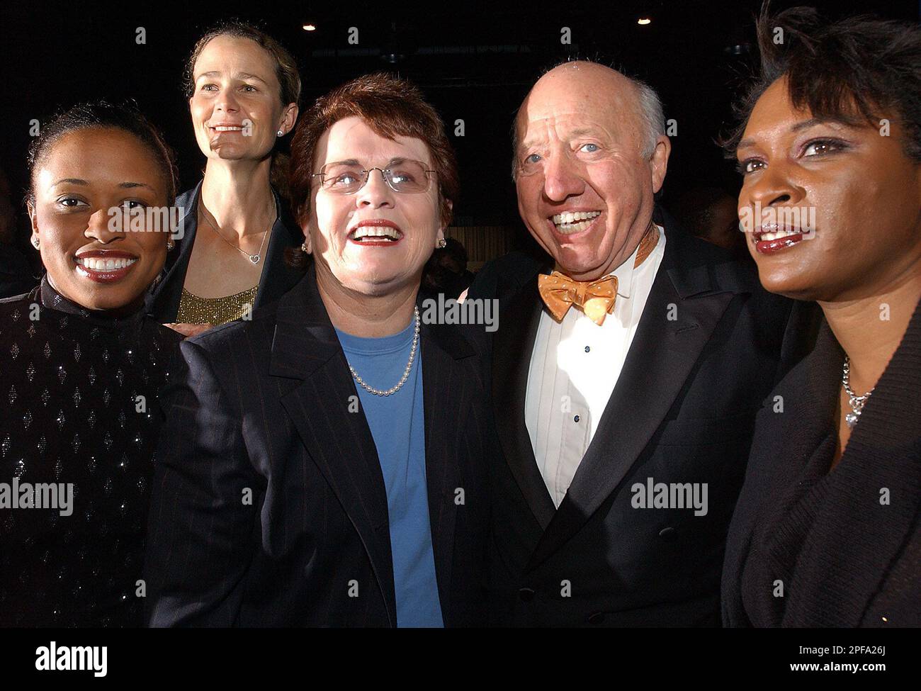 Tennis commentator Bud Collins, second from right, poses with tennis ...