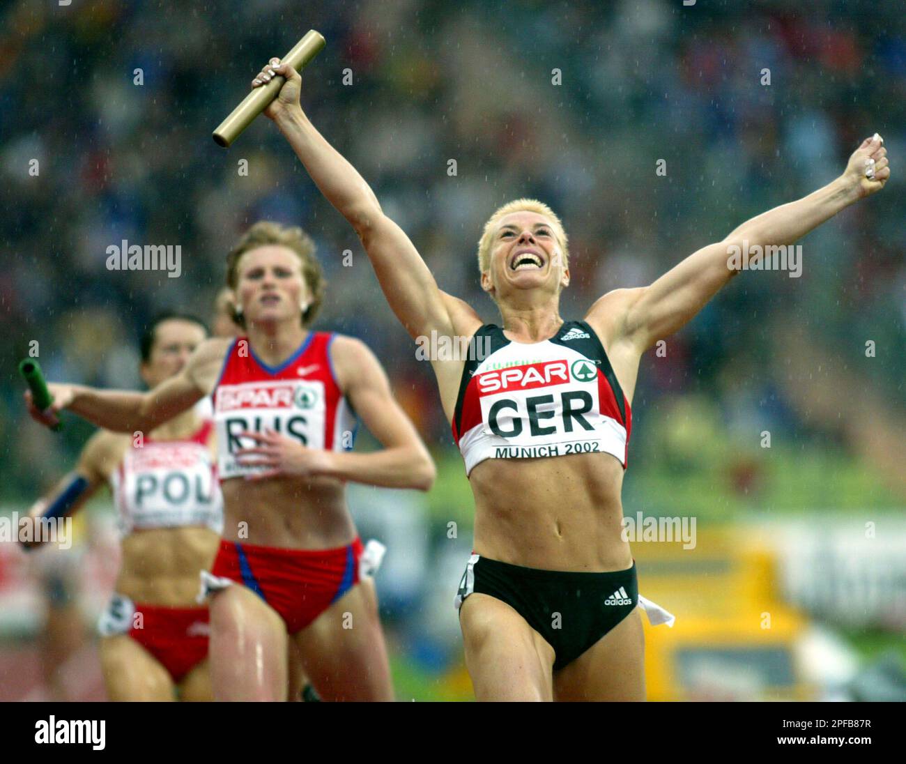 Birte Rutsch Germany's Grit Breuer crosses the finish line to help her team win the ...