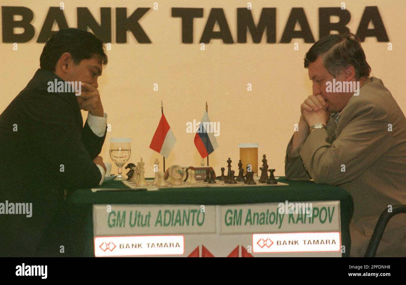 Indonesian grandmaster Utut Adianto, left, and top chess player Anatoly Karpov of Russia contemplate their moves during a match of rapid chess during the final day of the Clash of the Titans
