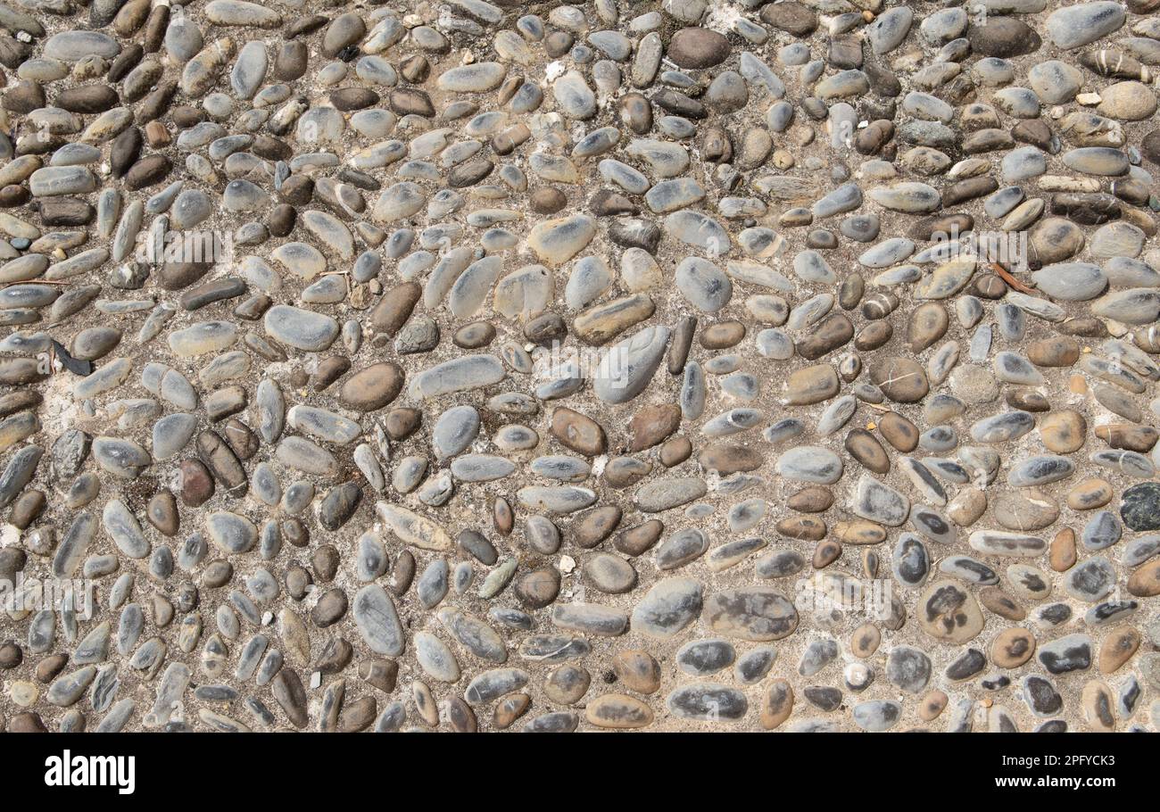 Hintergrund mit Kieselsteinboden für Außendesign. Stockfoto