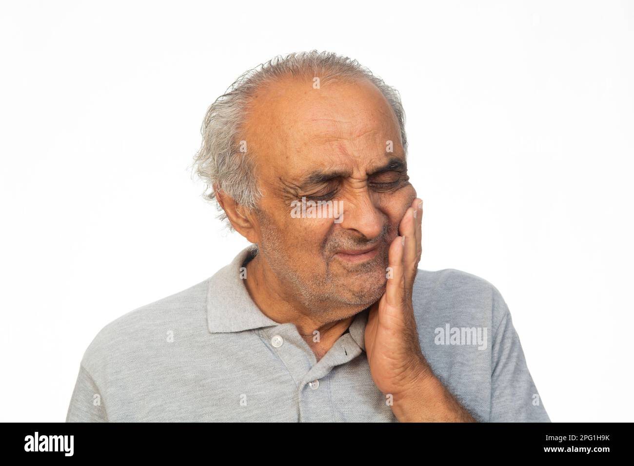 Alter Mann mit Zahnschmerzen Stockfoto