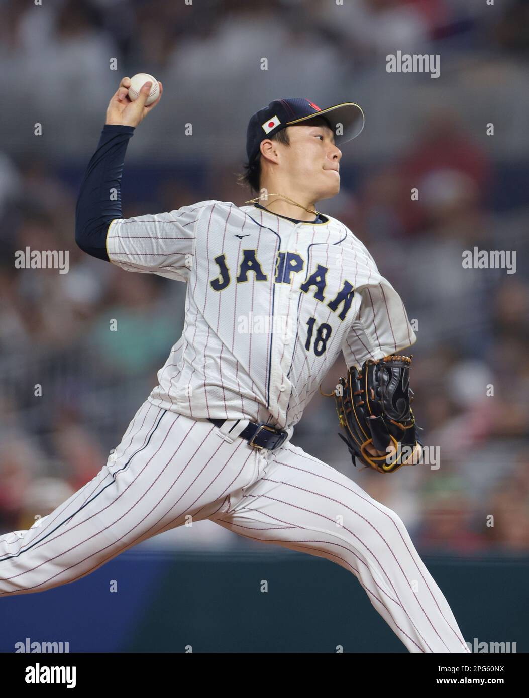 Yoshinobu Yamamoto of Japan throws a ball during the World Baseball