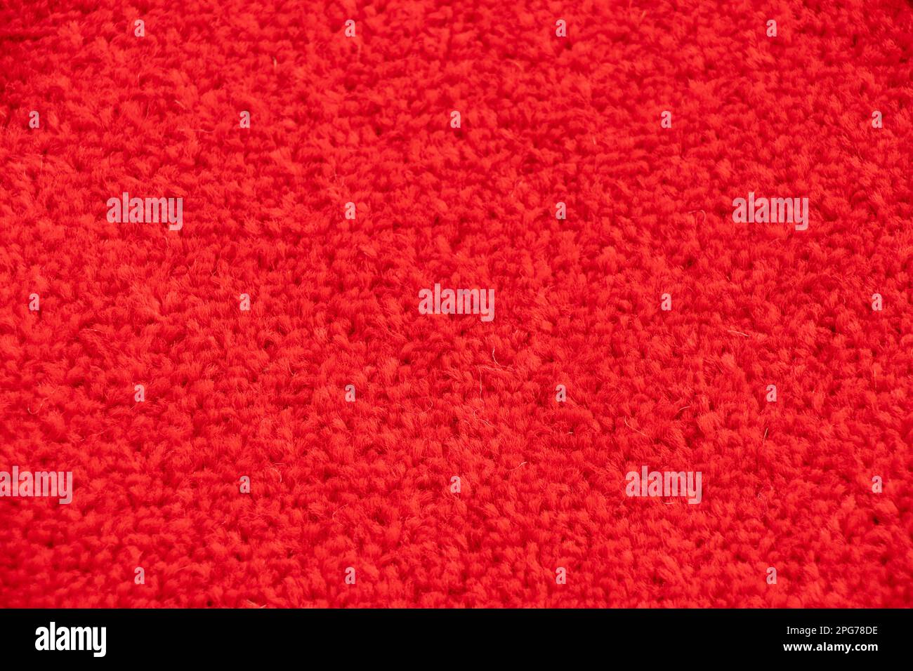 Rote Teppichnahaufnahme als Hintergrund Stockfoto