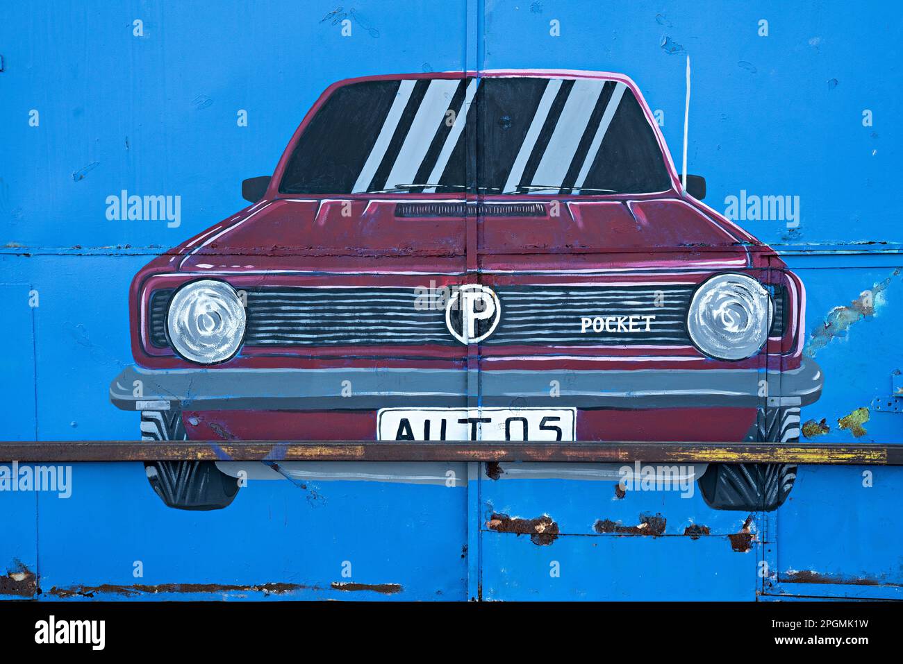 Grafische Gestaltung von Autos auf gewerblichen Garagentoren Stockfoto