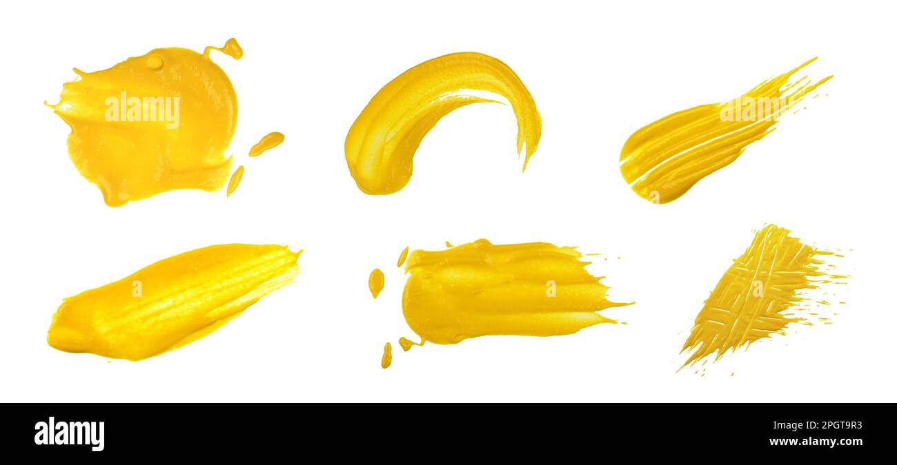Nahaufnahme verschiedener gelber amerikanischer Senfflecken, isoliert auf weißem Hintergrund, Draufsicht, direkt darüber Stockfoto