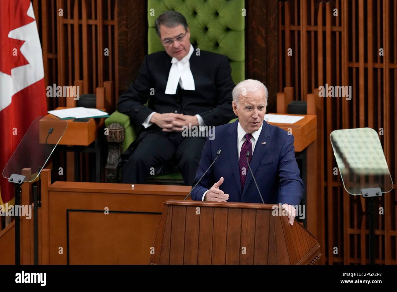 U.S. President Joe Biden addresses Parliament in the House of Commons, on Parliament Hill, in Ottawa, Friday, March 24, 2023. (Adrian Wyld /The Canadian Press via AP) Stockfoto