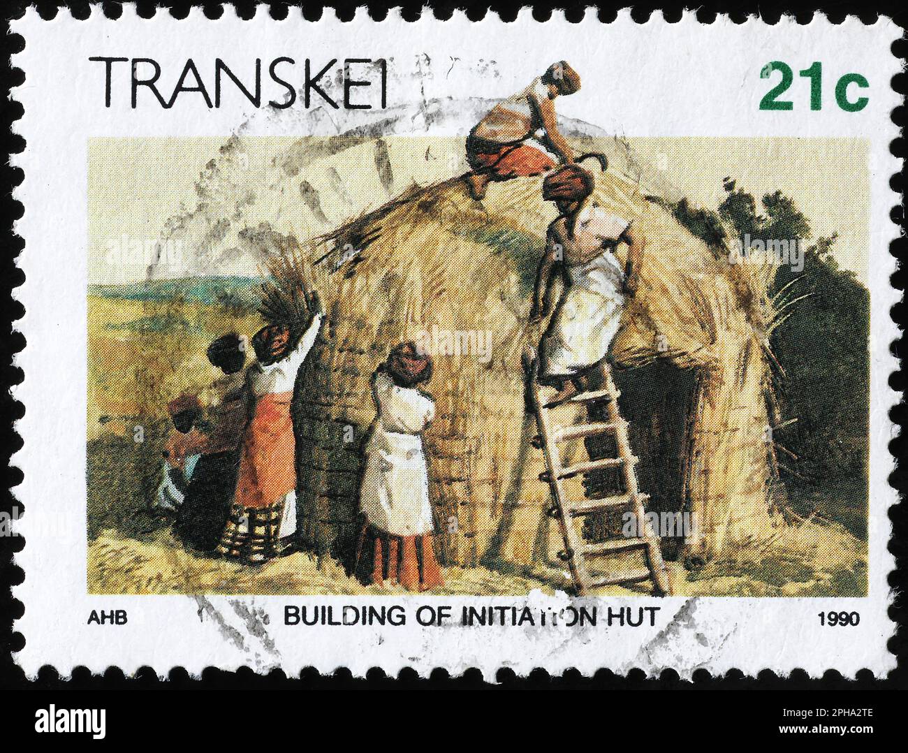 Bau einer strohgedeckten Hütte auf südafrikanischer Briefmarke Stockfoto
