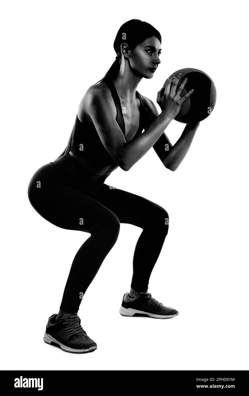 Sportlerin mit Medizinball isoliert auf weiß Stockfoto