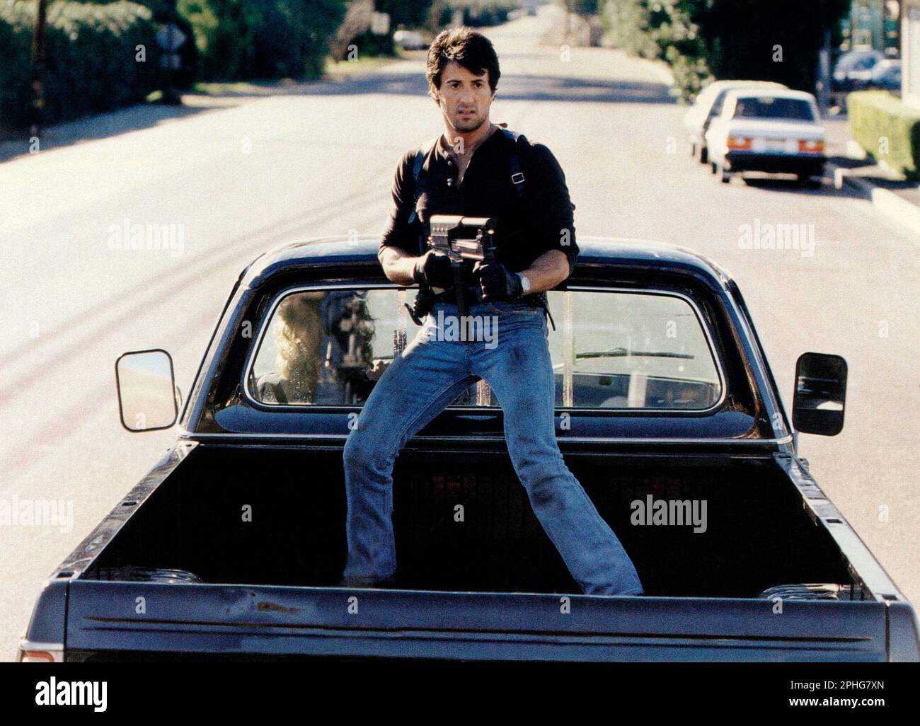 SYLVESTER STALLONE in COBRA (1986) unter der Leitung VON GEORGE P. COSMATOS. Kredit: WARNER BROTHERS / Album Stockfoto