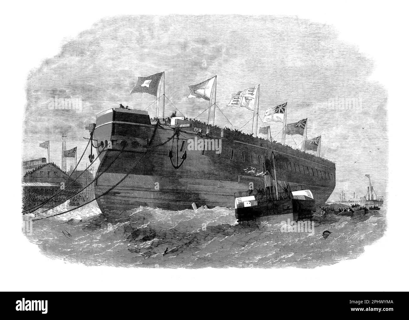 Der Start des 50-Pistolendampfschiffs „Minotaur“ aus der Werft der Thames Iron Shipbuilding Company in Blackwall, London, England. Sie diente im Mittelmeer und während des Ägyptischen Krieges 1882, verbrachte aber den Großteil ihrer aktiven Karriere als Flaggschiff der Kanalflotte. Stockfoto