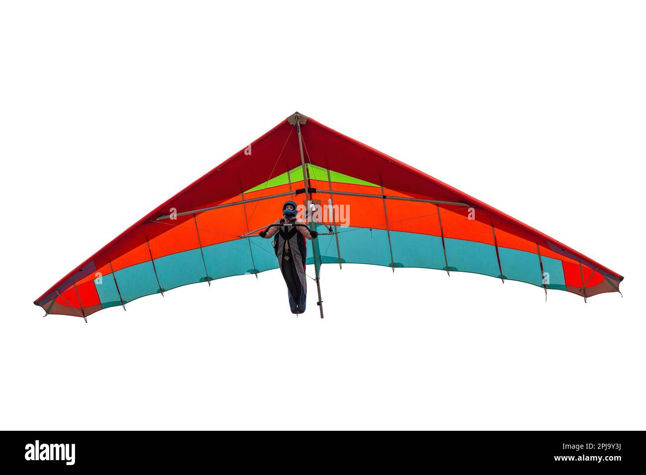 Farbenfroher Drachenflieger-Flügel isoliert auf Weiß. Pilotenmädchen schweben auf ihrem Flügel in den Himmel Stockfoto