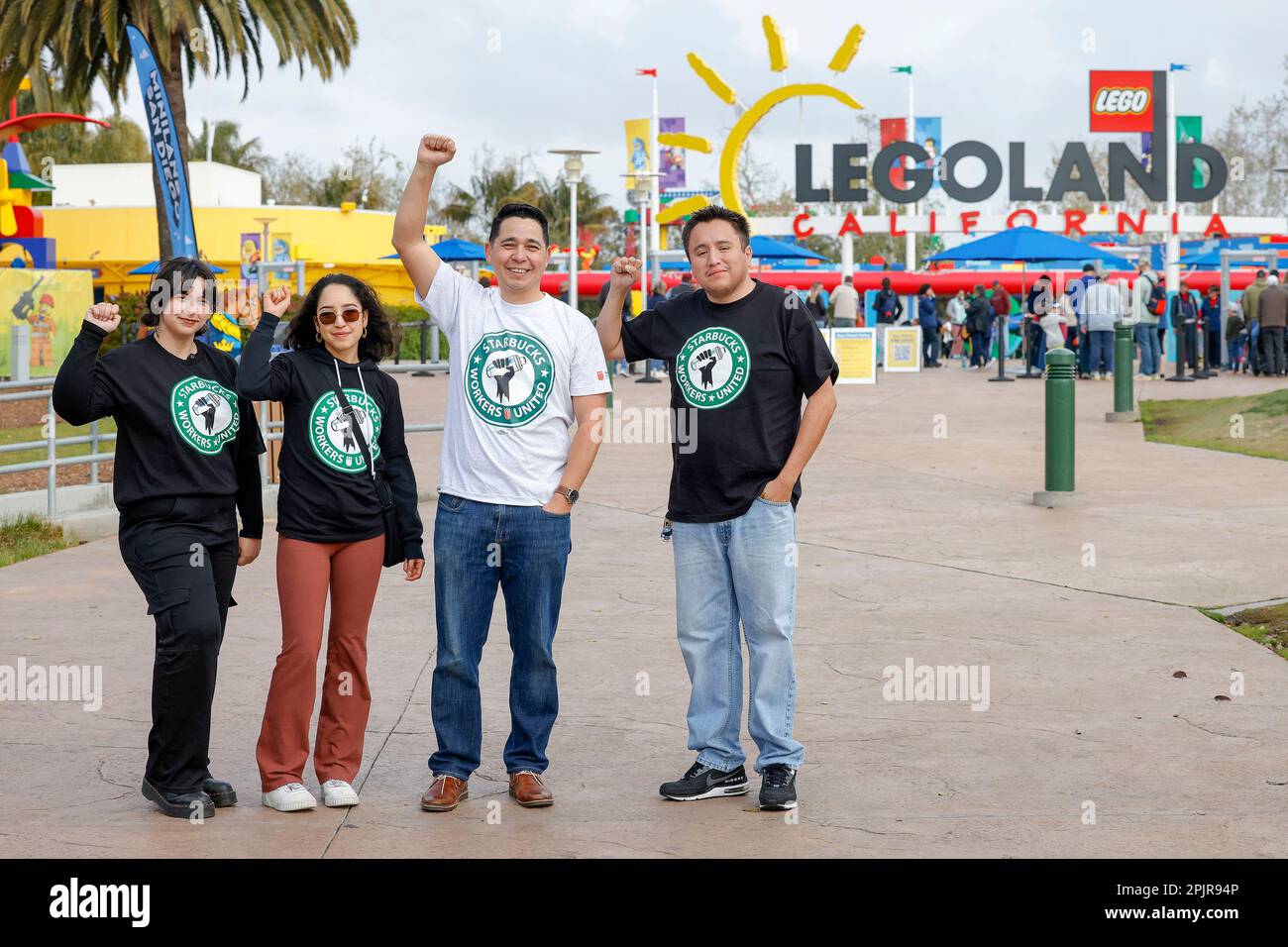 IMAGE DISTRIBUTED FOR MOVEMENT CATALYST Starbucks workers pose in front of LEGOLAND in Carlsbad CA where they distributed leaflets and released a short animated film on a mobile billboard that circled