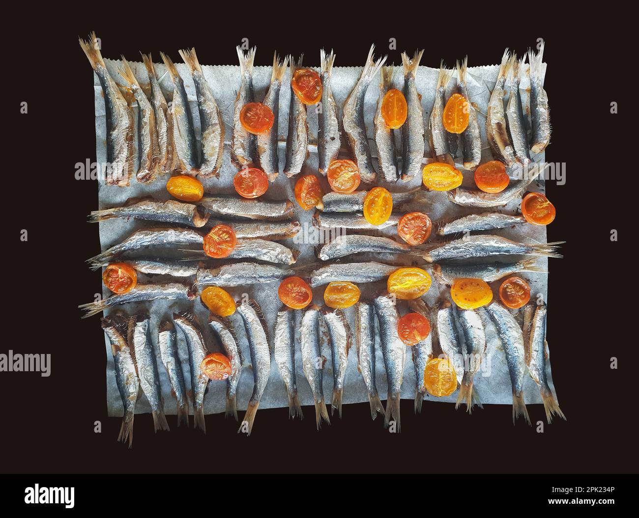 Gebackene Sardinen mit Sherry-Tomate Stockfoto