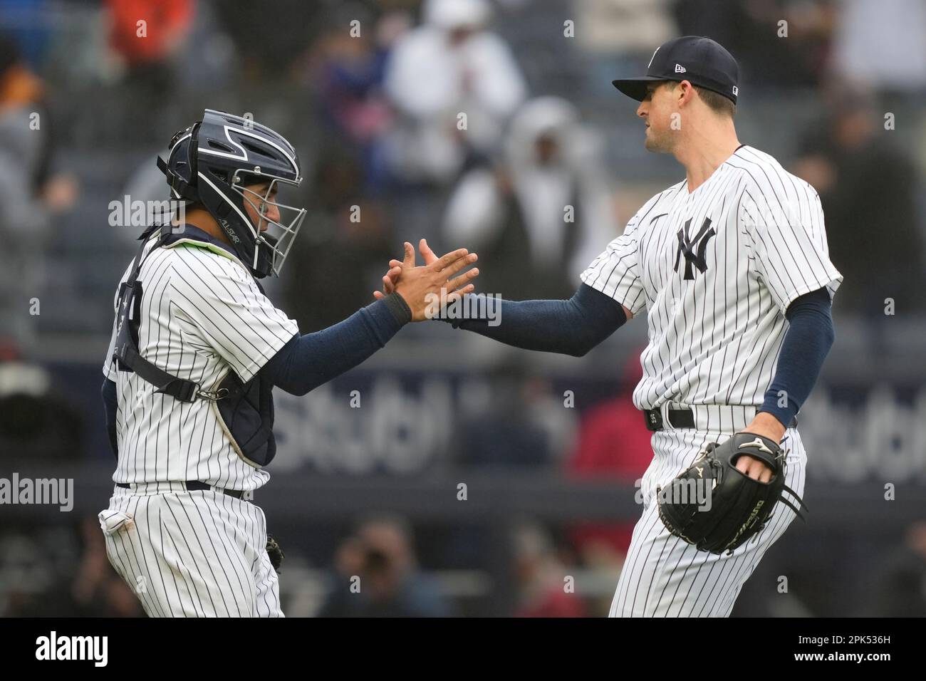 New York Yankees relief pitcher Clay Holmes, right, celebrates with