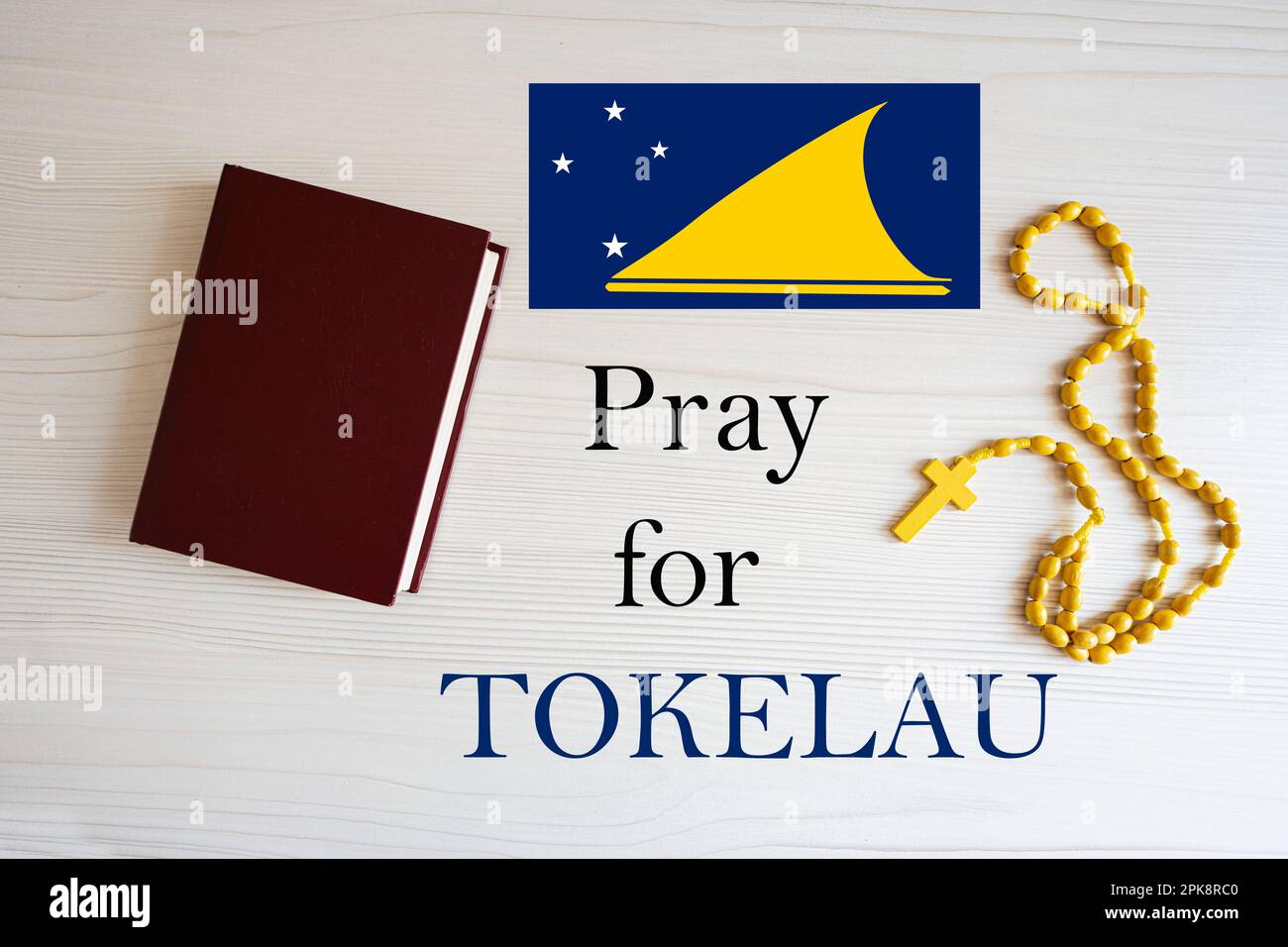 Bete für Tokelau. Rosenkranz und Heilige Bibel. Stockfoto