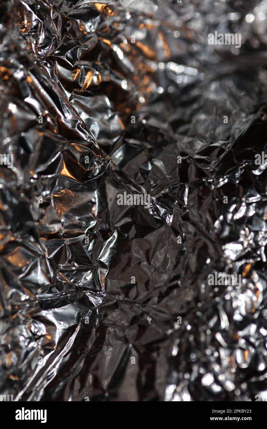 Aluminium Blattwerk Lichteffekte Design Feuershow Party festliche Dekorationen abstrakt verschwommener Hintergrund leuchtende Textur glänzendes Muster große, moderne Größe Stockfoto