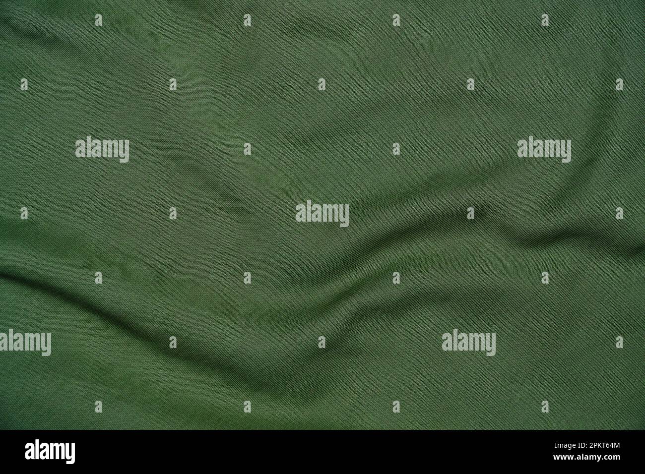 Abstraktes Material, zerknitterter grüner Hintergrund Stockfoto