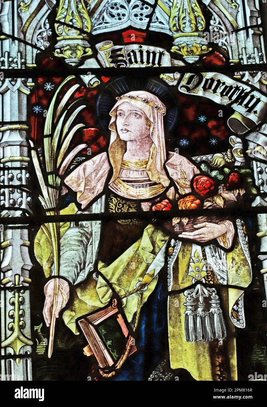 Buntglasfenster von Percy Bacon & Brothers mit Darstellung der Heiligen Dorothy, der Kirche St. Hilda, Lucker, Northumberland Stockfoto