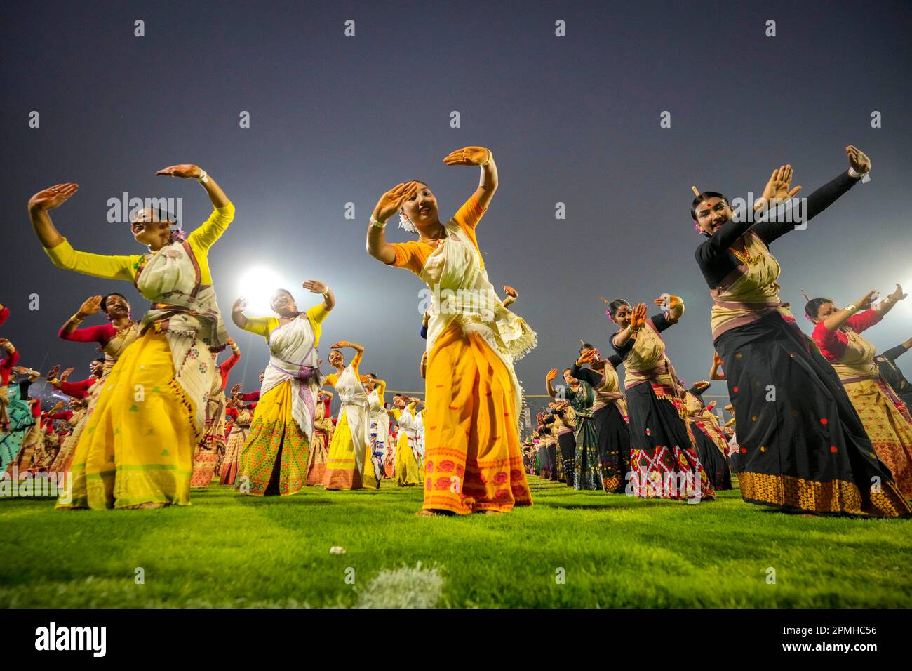 Assamese dancers in traditional attire perform as they attempt Guinness