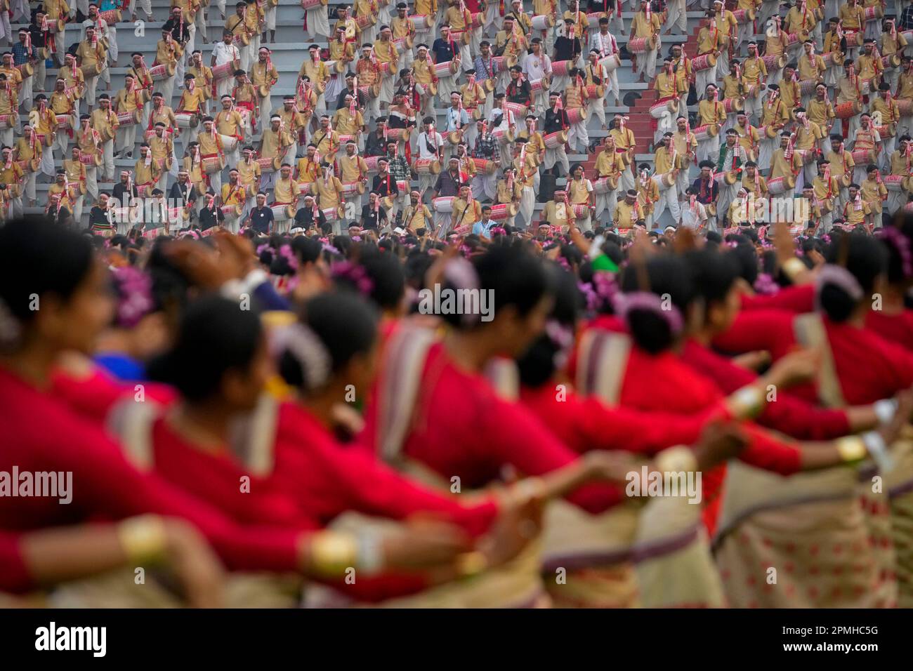 Assamese dancers in traditional attire perform as they attempt Guinness