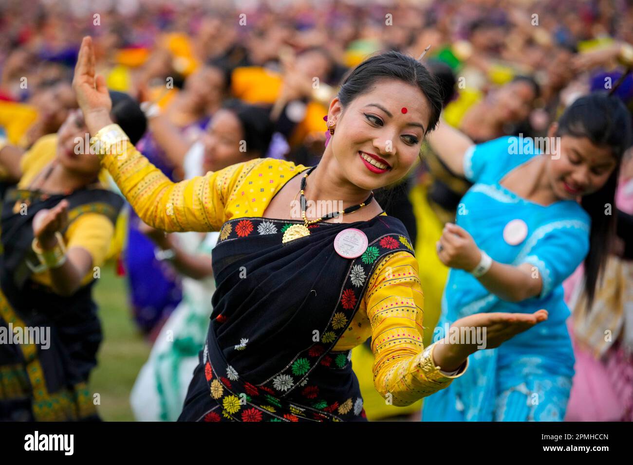 Assamese dancers in traditional attire perform as they attempt Guinness