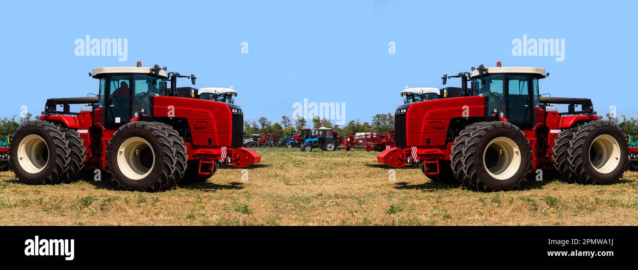 Landwirtschaftliche Traktoren auf dem Feld. Hochwertiges Foto Stockfoto