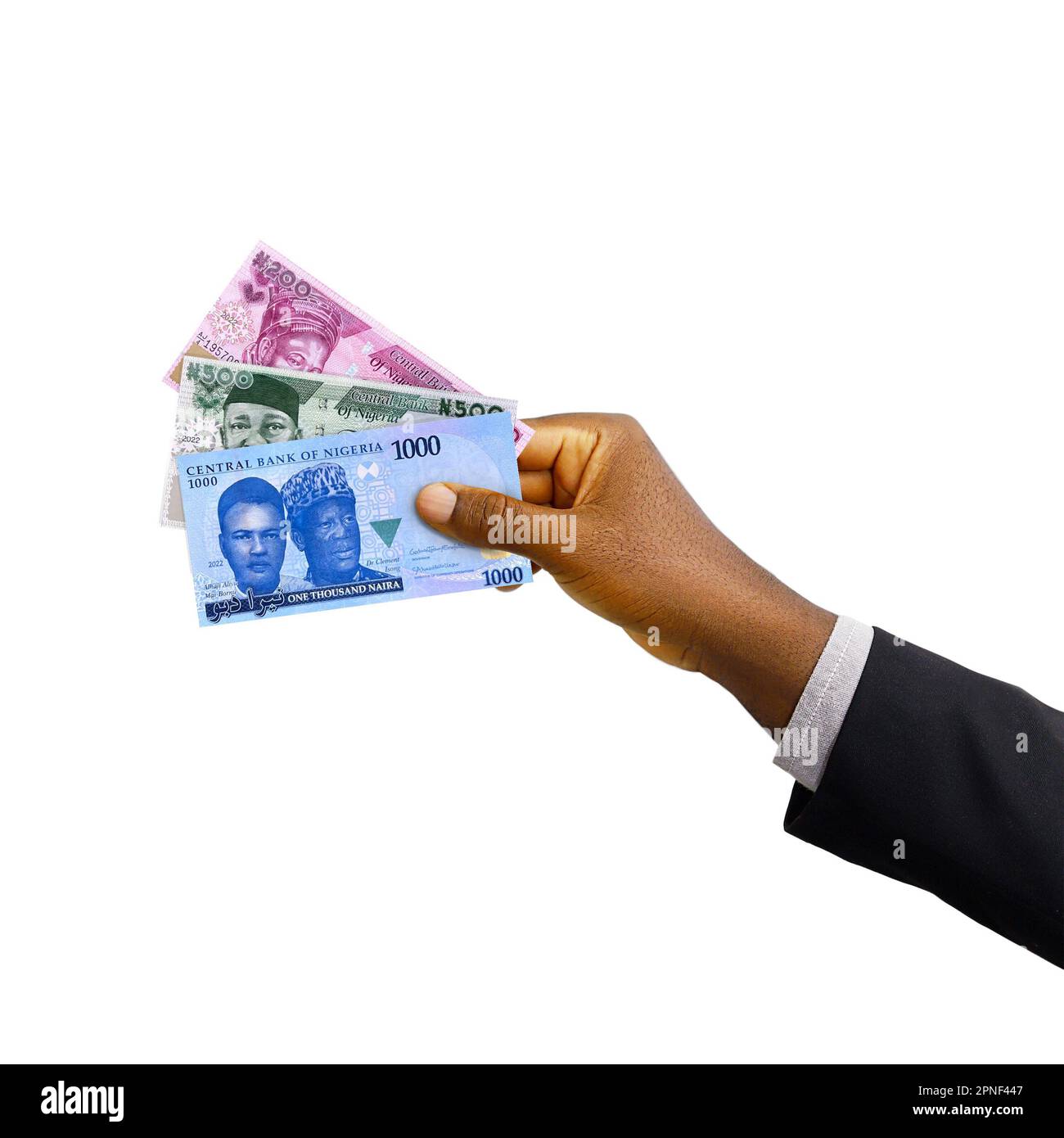 Schwarze Hand mit Anzug mit Noten von New Nigerian Naira isoliert auf weißem Hintergrund, 3D-Rendering Stockfoto