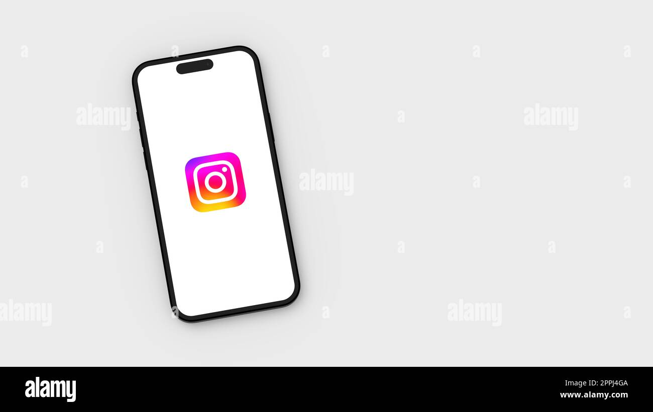 Instagram-Logo auf dem Handybildschirm auf grauem Hintergrund mit Kopierbereich Stockfoto