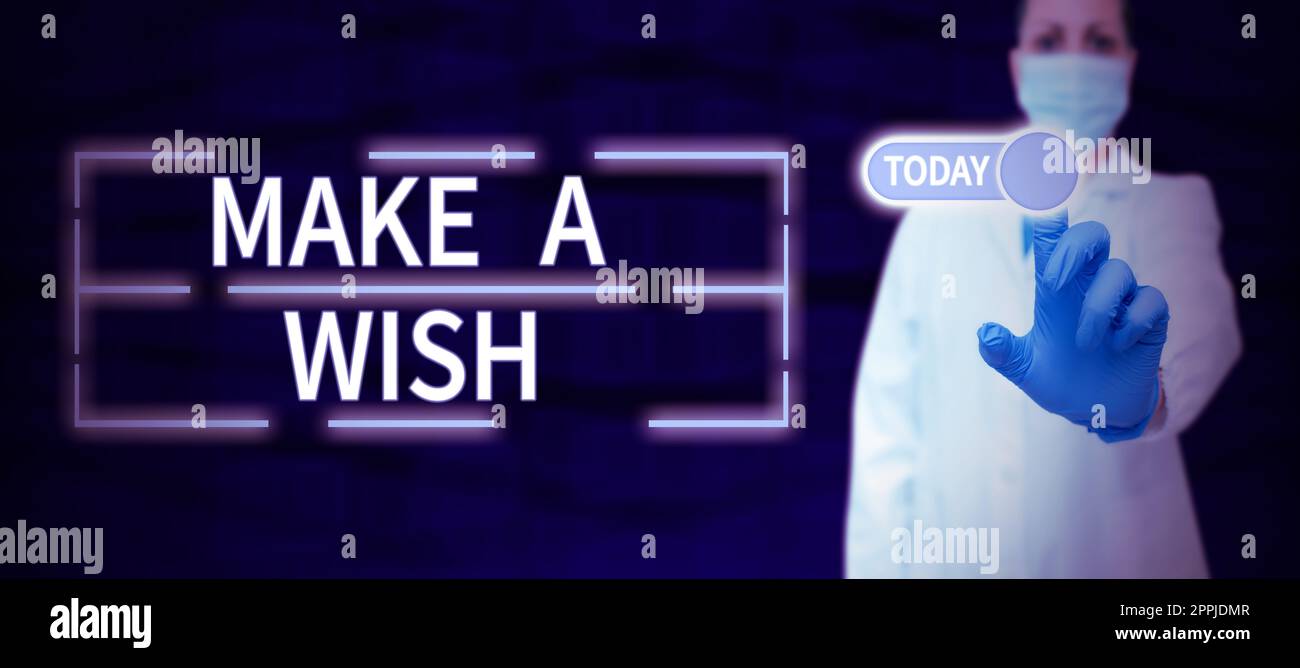 Textzeichen mit „Make A wish“. Konzept bedeutet, eine Situation zu wünschen, die sich von der Situation unterscheidet, die existiert Stockfoto