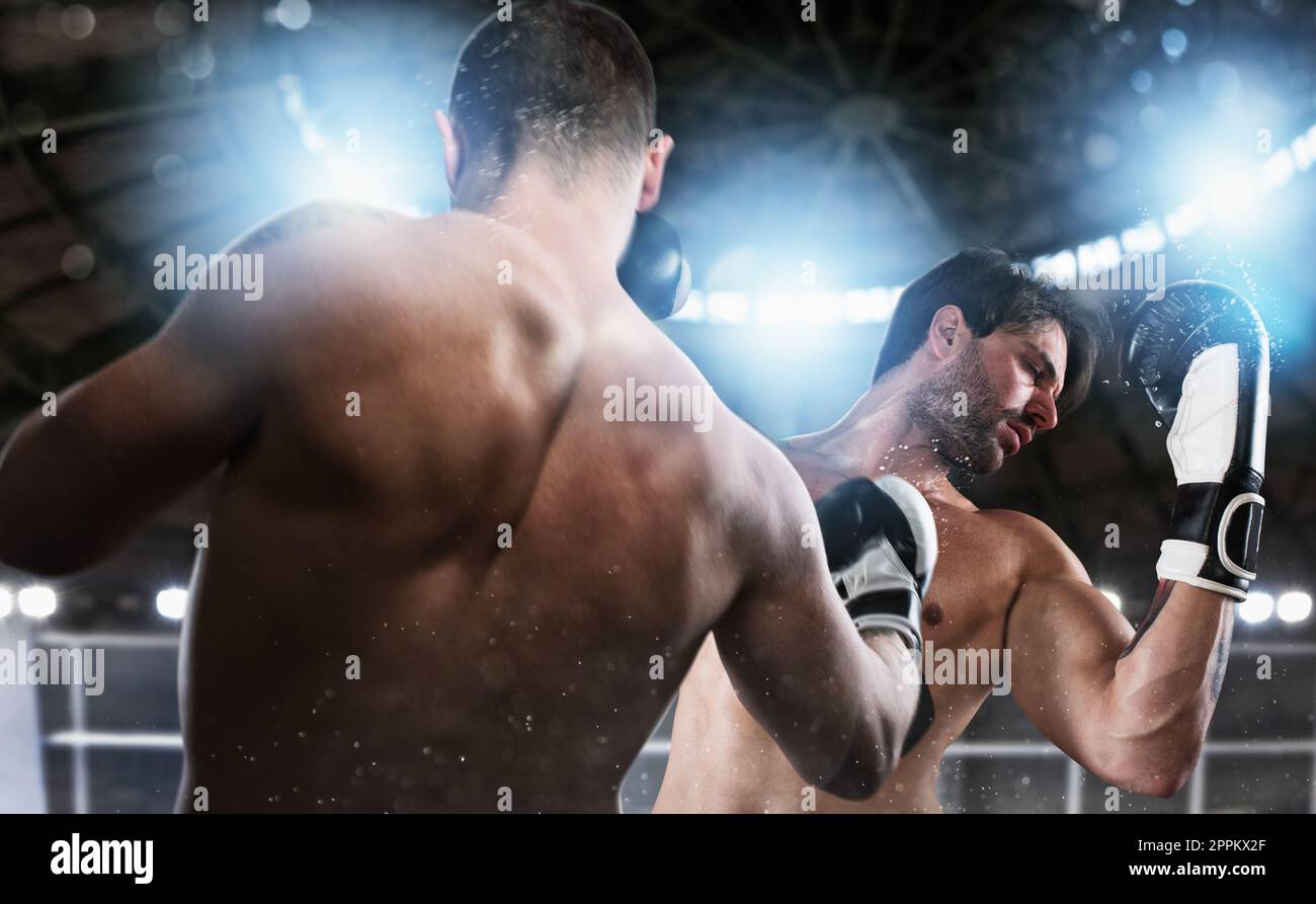 Boxer in einem Boxenwettbewerb schlägt seinen Gegner. Stockfoto