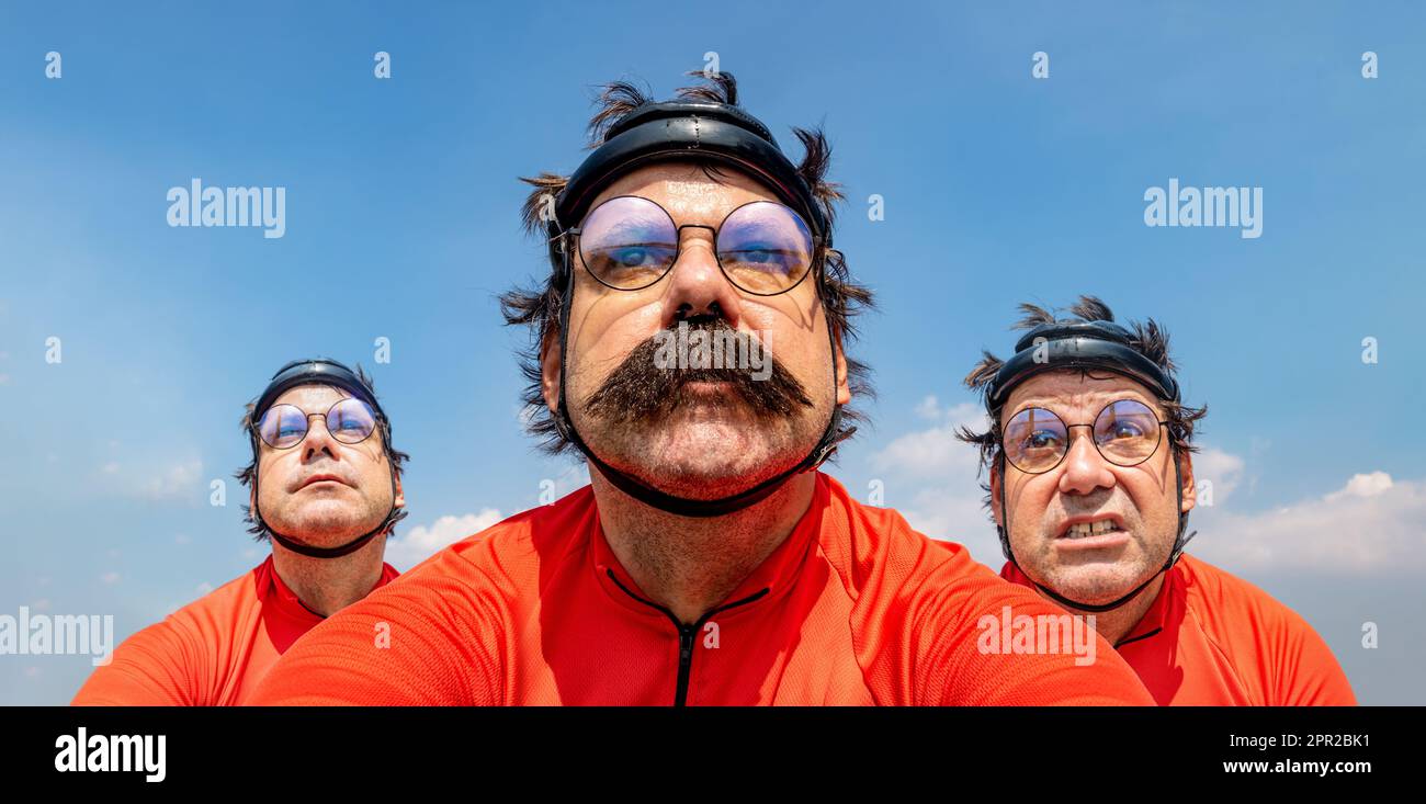 Porträt eines Trios von Radfahrern unter blauem Himmel Stockfoto