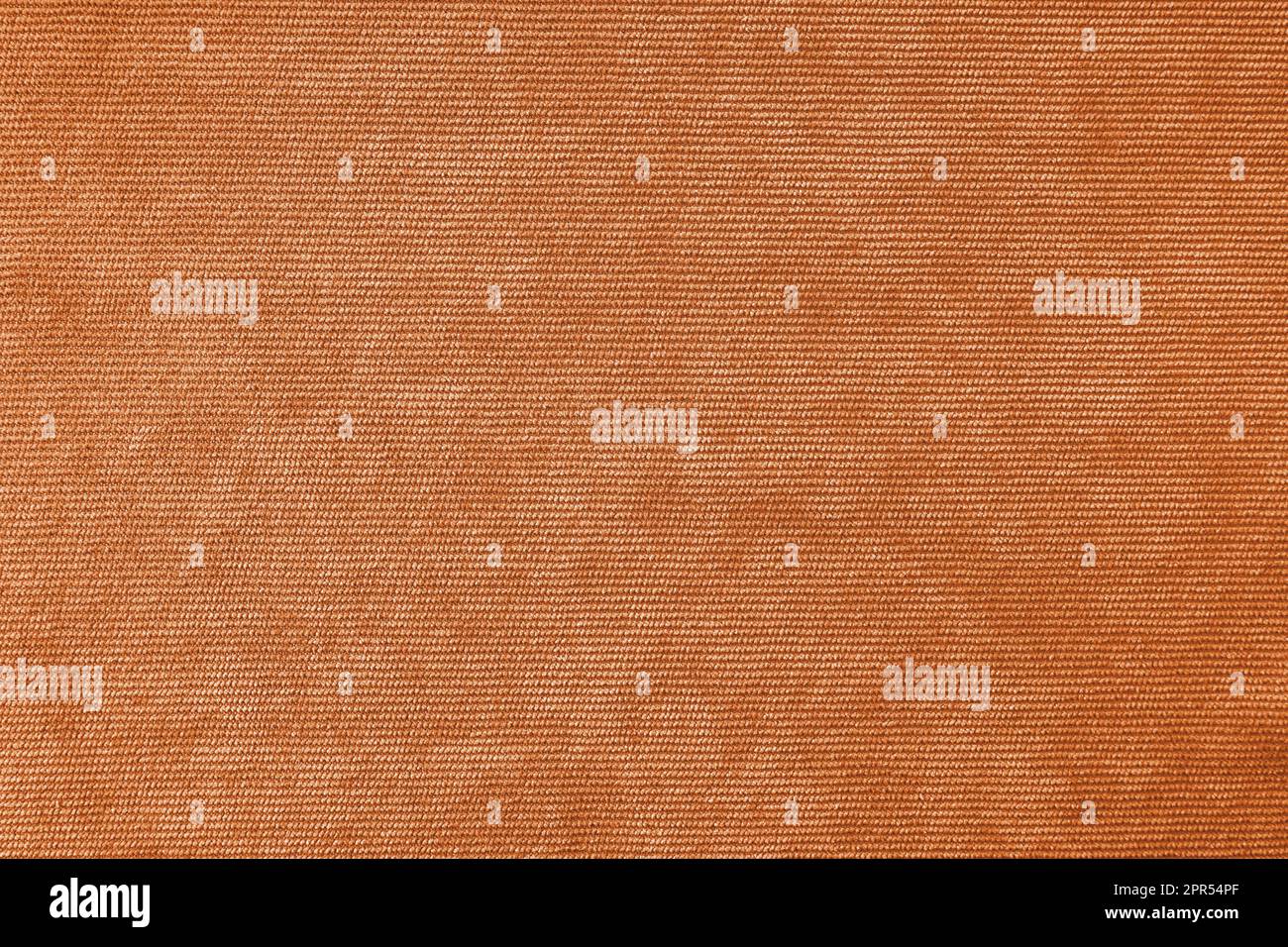 Texturhintergrund aus Velours-Orange. Polstermaterial aus Samt, Textilmaterial für Cordmöbel, Inneneinrichtung, Einrichtung. Grat f Stockfoto