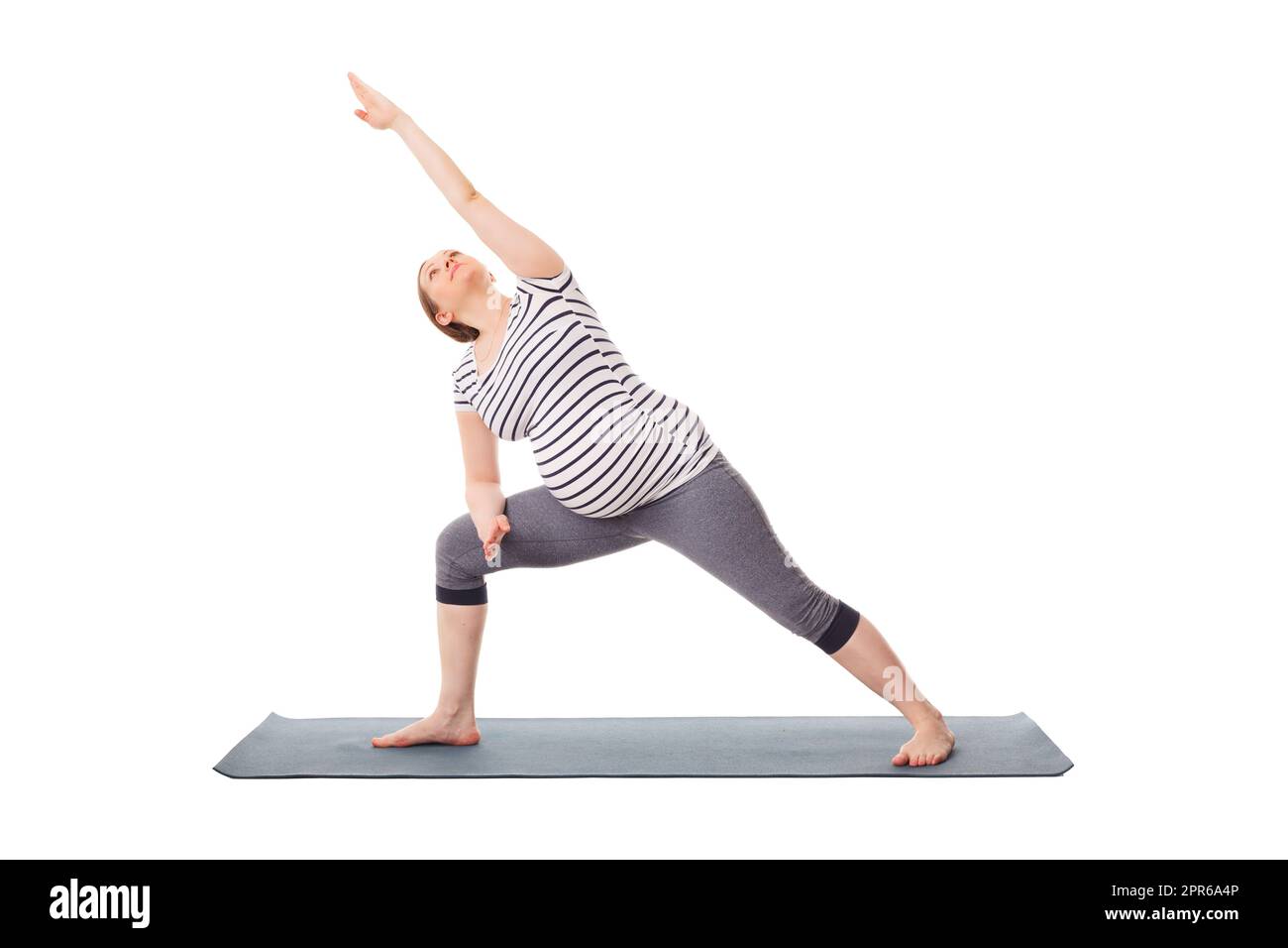 Schwanger Frau macht Yoga Asana Utthita Parsvakonasana Stockfoto