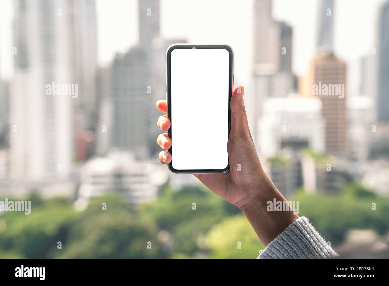 Weißes Display des Mobiltelefons mit Handhaltung Stockfoto