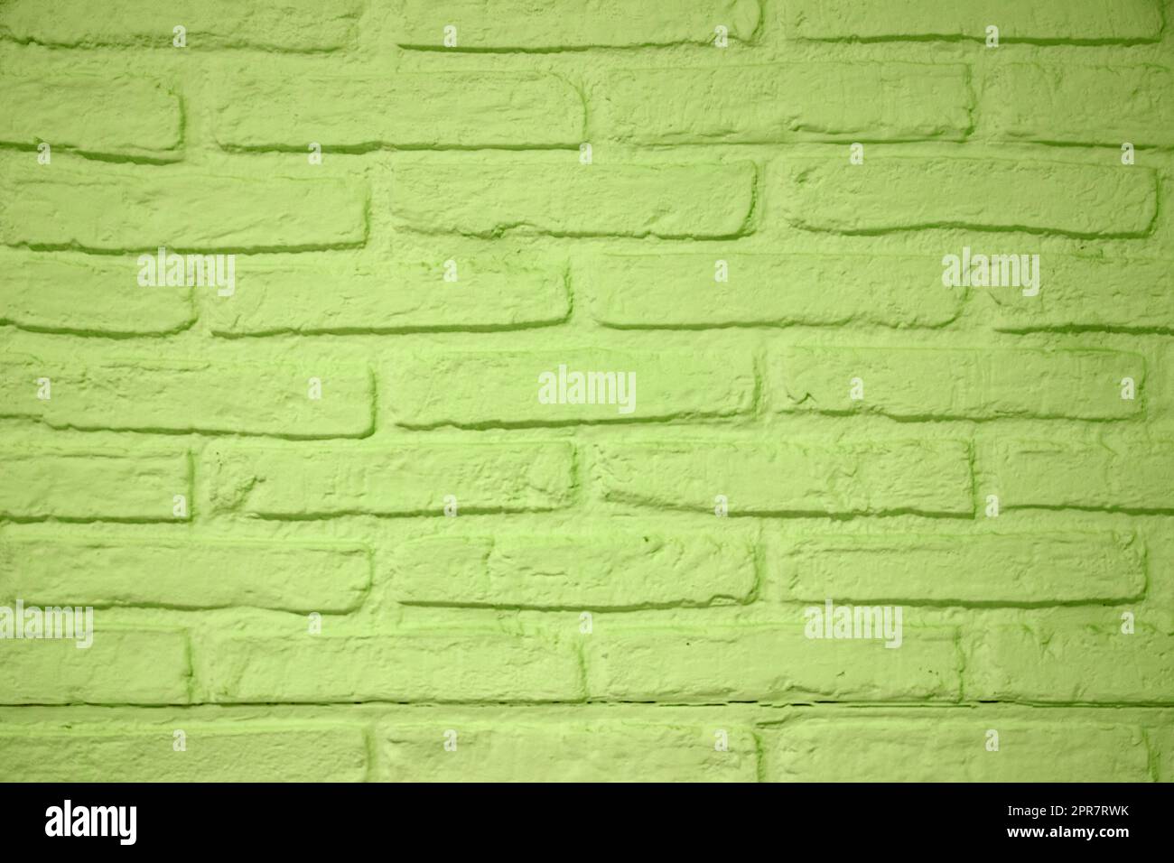 Hintergrund der Steintextur. Nahaufnahme einer Wandtextur aus grünem Ziegelstein. Abstraktes Backsteinmuster Hintergrundkonzept, Retro-Layout, Innendesign und Wandbanner. Stockfoto