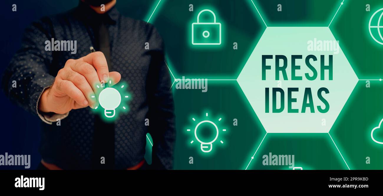 Handschrift Text frische Ideen. Internetkonzepte Gedanken oder Anregungen zu möglichen Vorgehensweisen, die ein handgehaltener Geschäftsmann als Symbol erfolgreicher Teamarbeit darstellt. Stockfoto